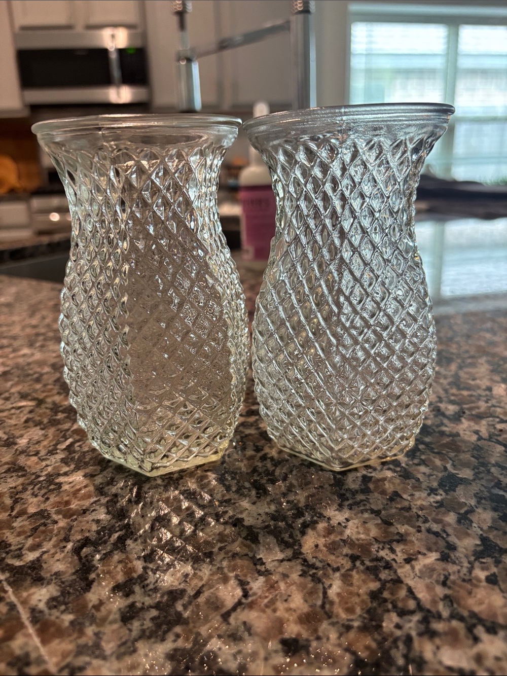 These vintage Hoosier Glass bud vases feature a clear, hexagonal,